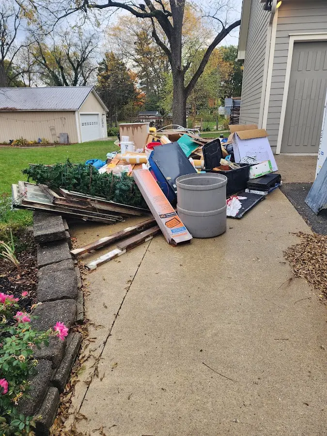 Dumpster being loaded with debris for 3 Yard Dumpster Rental in DeForest